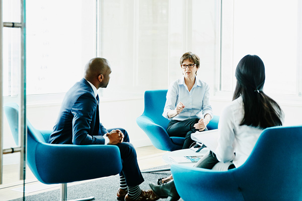 Group of people in an office setting having a discussion